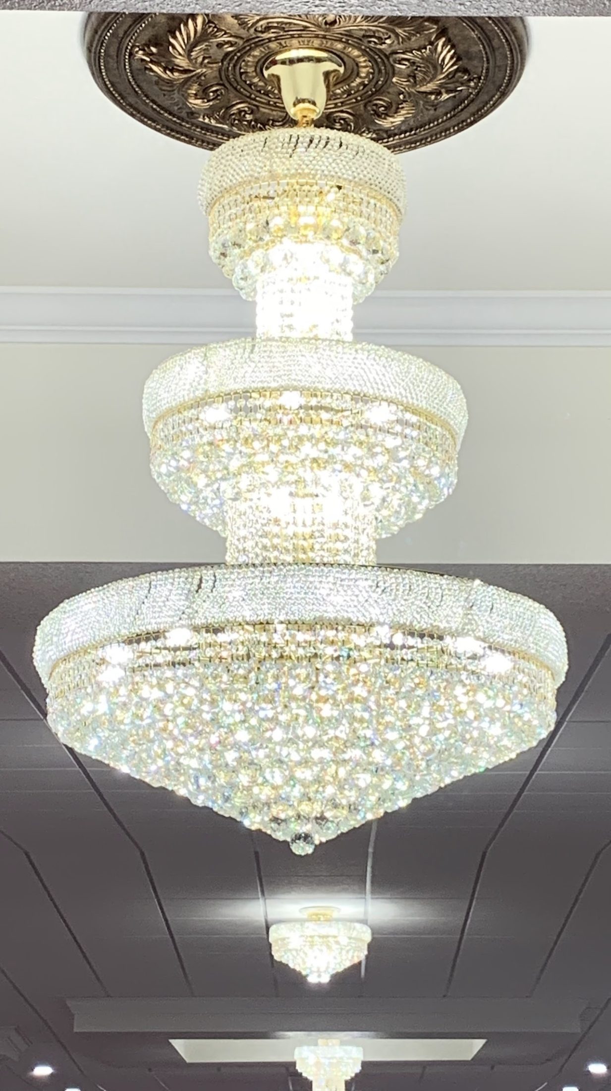 Close-up of sparkling crystal chandeliers in the hall.