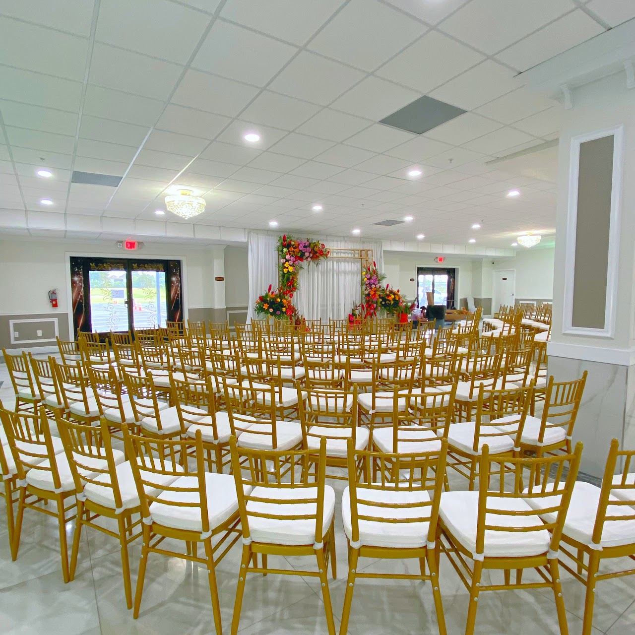 Reception area with ambient lighting and floral centerpieces.